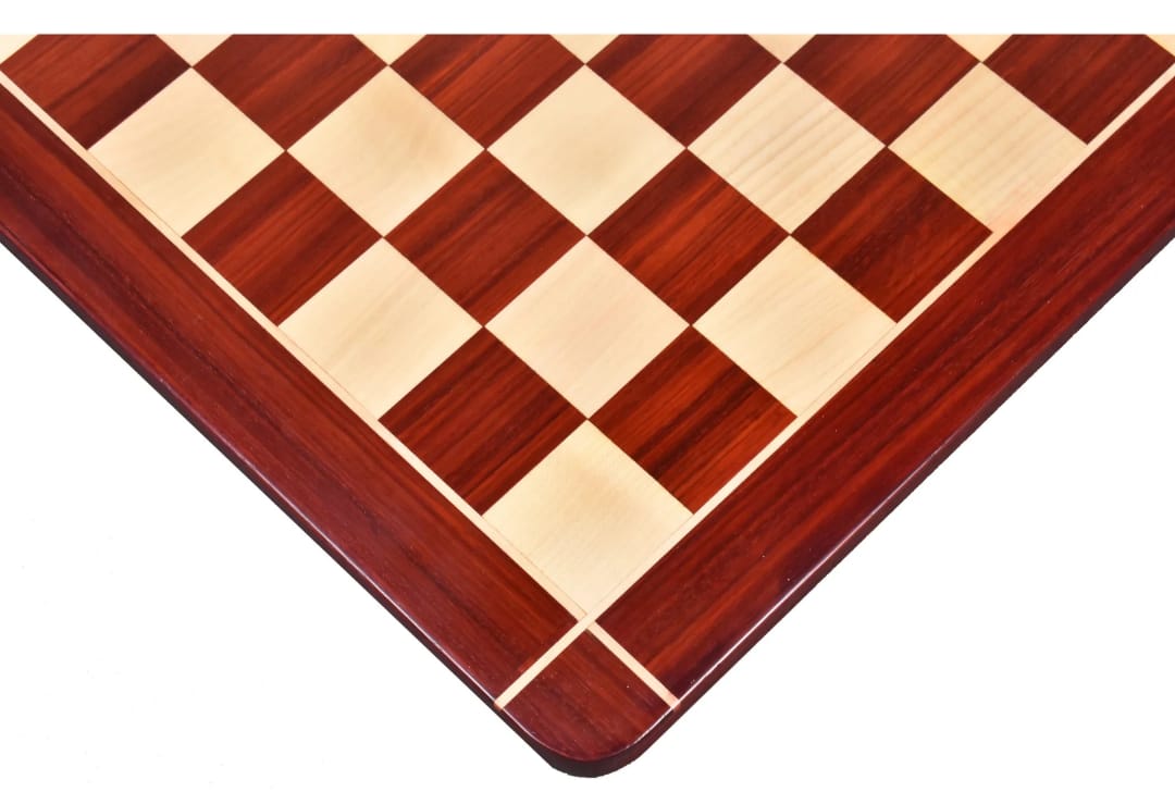 Close-up of a hand crafted Bud Rosewood chess board showing checker pattern with rich wood finish.