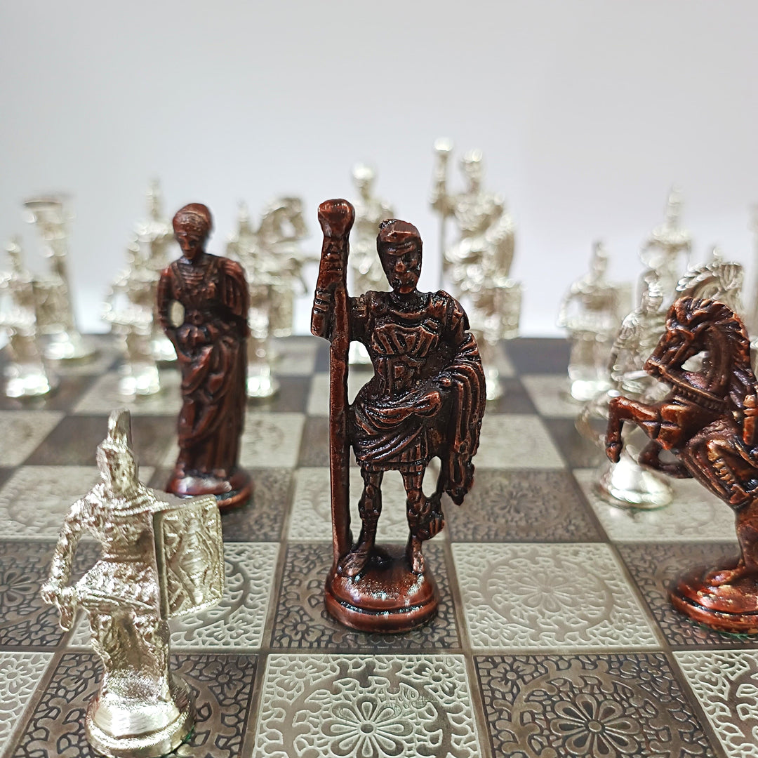 Roman soldiers themed brass chess pieces on a decorative board, showcasing detailed figurines in bronze and silver finishes.