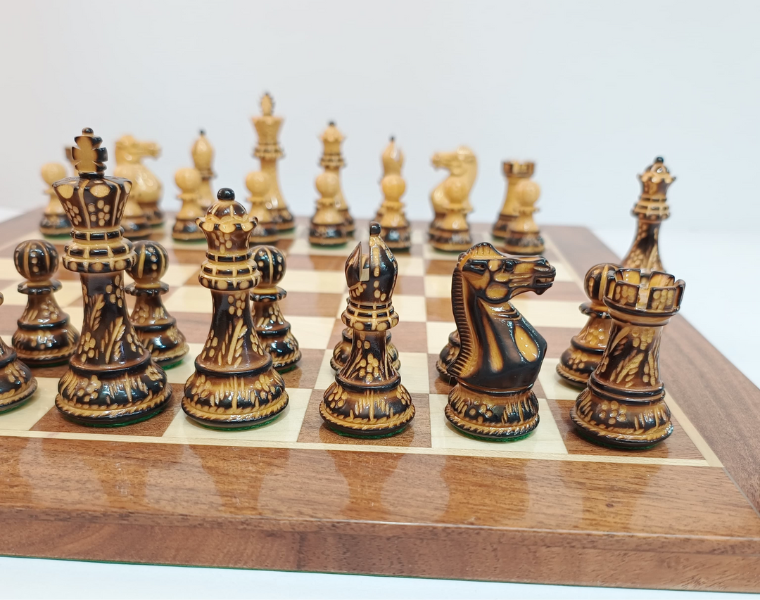 Close-up of hand-carved Burnt Staunton wooden chess pieces on a polished board, showcasing luxury craftsmanship.