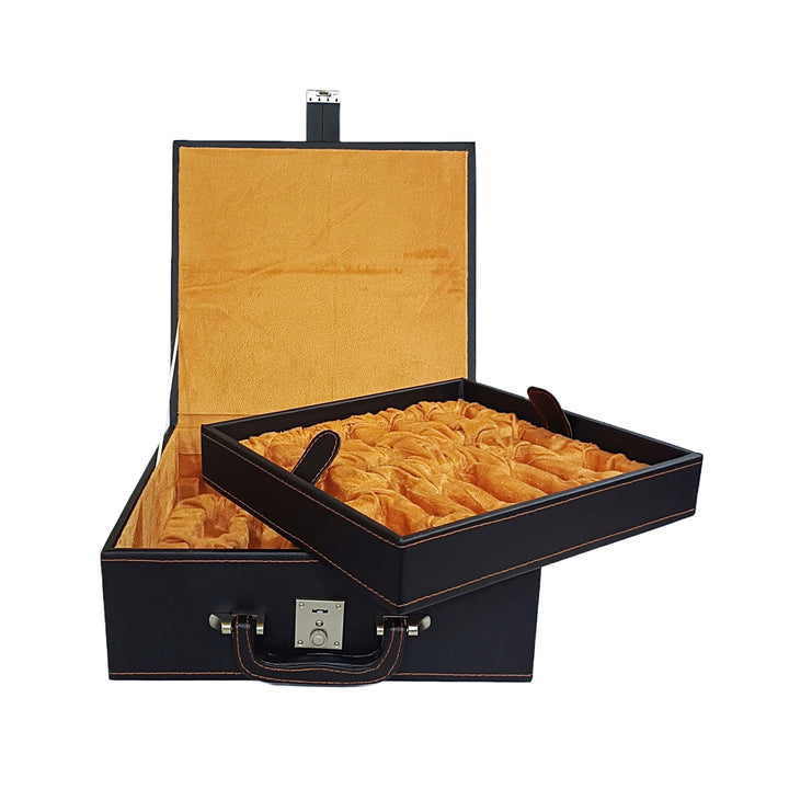 Leatherette chess storage box with dual tray design and orange interior, showcasing open lid and chess piece compartments.