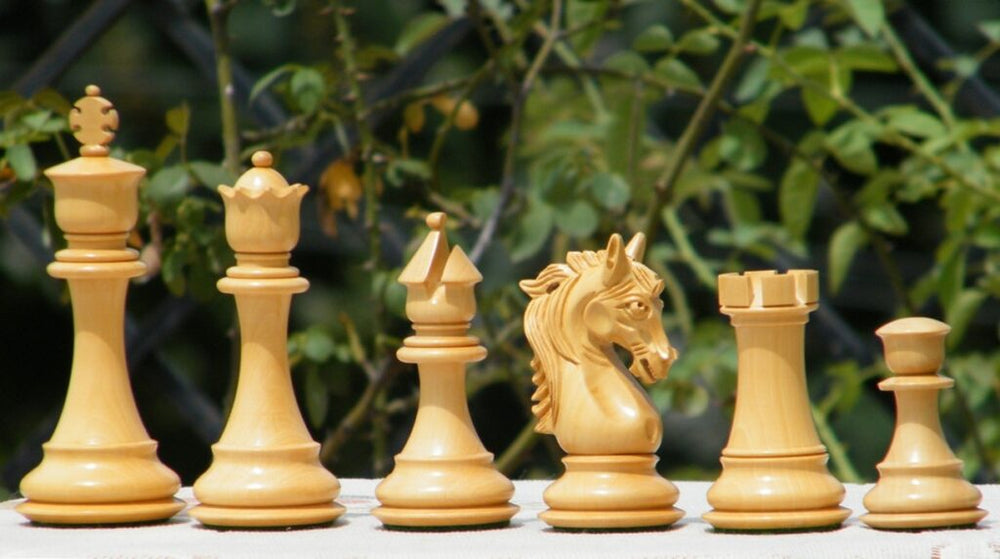 Stallion Knight luxury chess pieces in Padauk and Boxwood, showcasing king, queen, bishop, knight, rook, and pawn.