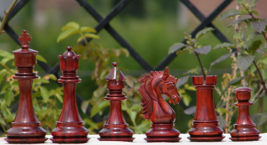 Stallion Knight luxury chess pieces featuring hand-carved Padauk wood, showcasing king, queen, knight, and rook.