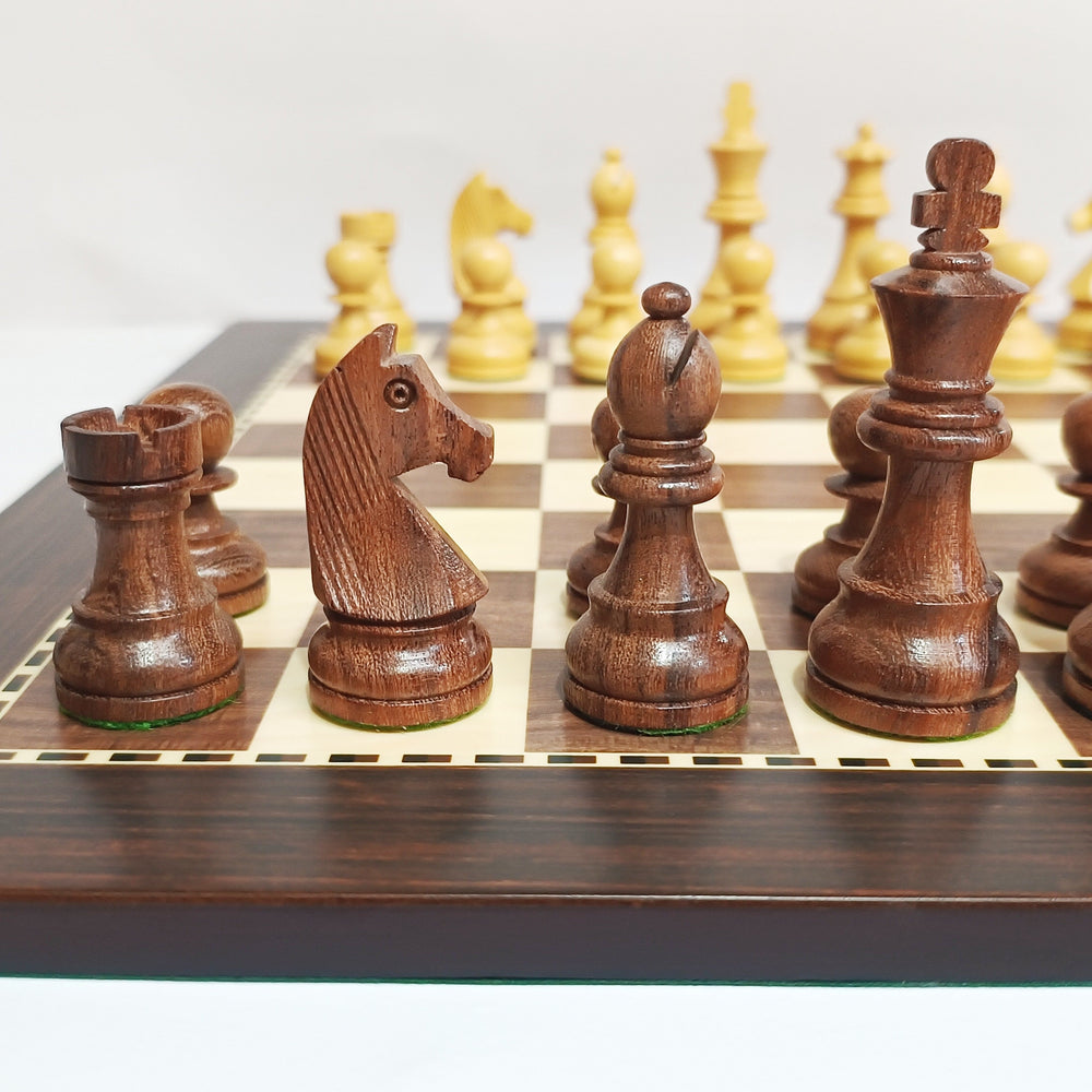 Classic Staunton wooden chess set on an MDF board, featuring brown and beige pieces and a close-up of the knight and pawns.